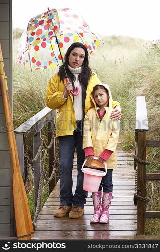 Mother and daughter with umbrella