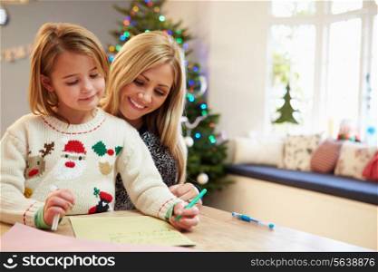 Mother And Daughter Writing Letter To Santa Together