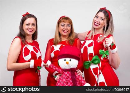 Mother and daughters on christmas clothing against a white background