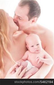 Mother and father with newborn baby close up