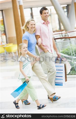 Mother and father with young daughter at a shopping mall