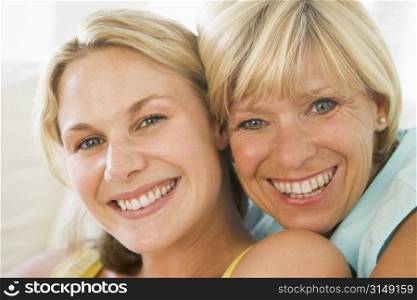 Mother and grown up daughter smiling