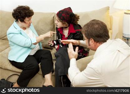 Mother and her rebellious teen daughter fighting while the counselor calls for a time out.