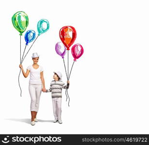 Mother and her son. Image of young happy smiling family walking