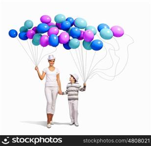 Mother and her son. Image of young happy smiling family walking