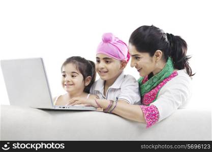 Mother and kids looking at a laptop