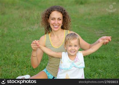 mother and little daughter on the meadow