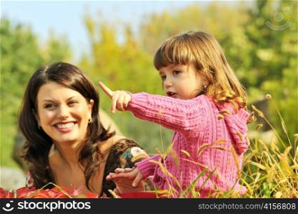 Mother and little girl in park
