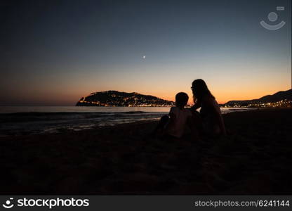 Mother and son at Alanya beach, view from the beach, one of the famous destinations in Turkey.