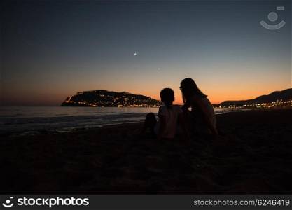 Mother and son at Alanya beach, view from the beach, one of the famous destinations in Turkey.
