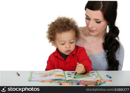 Mother and son coloring-in together