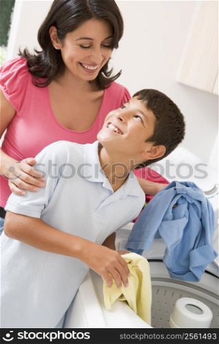 Mother And Son Doing Laundry