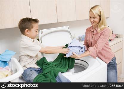 Mother And Son Doing Laundry