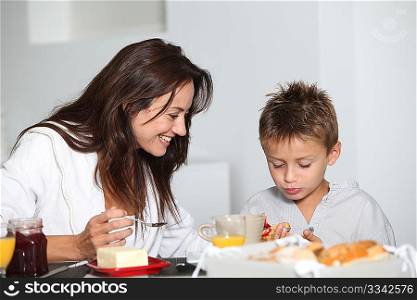 Mother and son having breakfast