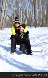 Mother and son in a winter park