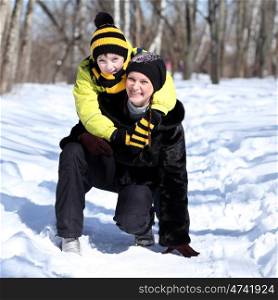 Mother and son in a winter park