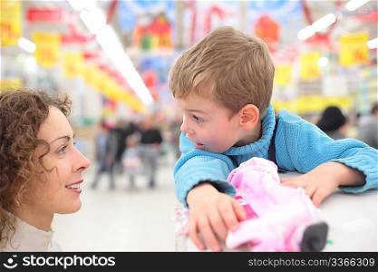 Mother and son in shop