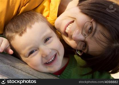 mother and son laughing and hugging