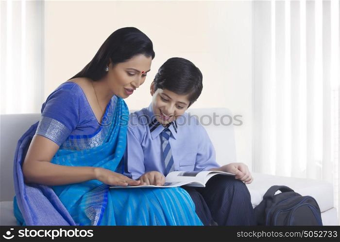 Mother and son looking at pictures