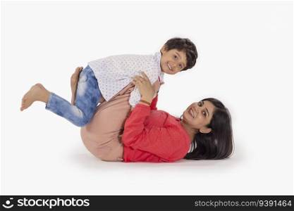Mother and son playing together against white background