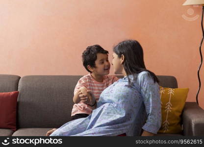Mother and son playing together in living room