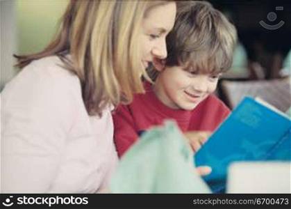 mother and son reading together