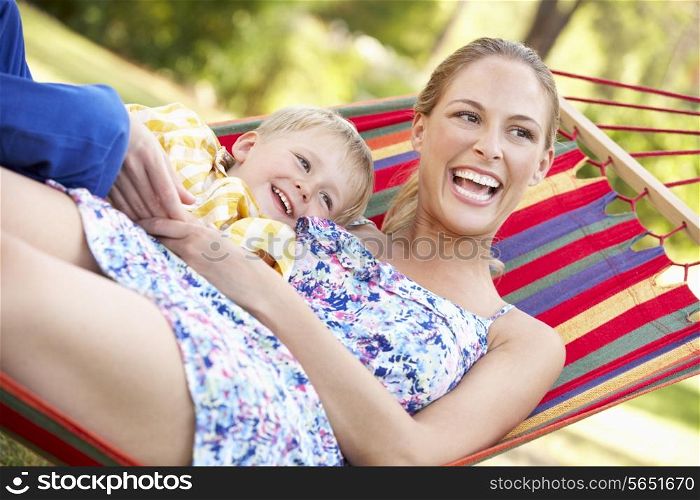 Mother And Son Relaxing In Hammock