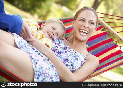 Mother And Son Relaxing In Hammock