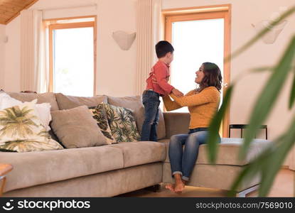 Mother and son relaxing together in the living room