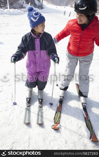 Mother and Son Skiing in Ski Resort