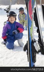 Mother and Son Smiling in Ski Resort