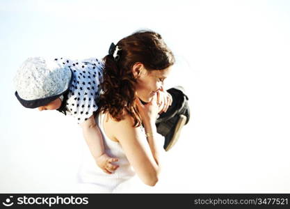 mother and take son in blue sky