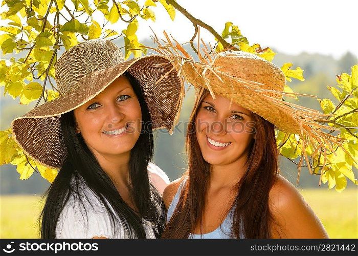 Mother and teen daughter relaxing outdoors happy summer bonding vacation