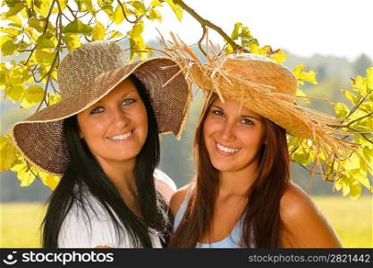 Mother and teen daughter relaxing outdoors happy summer bonding vacation