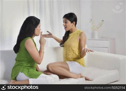 Mother asking daughter to keep quiet