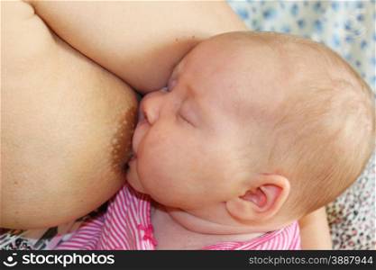 mother breastfeeding baby who fell asleep during this. mother breastfeeding baby