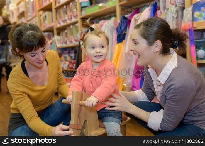 mother buy toy for her child