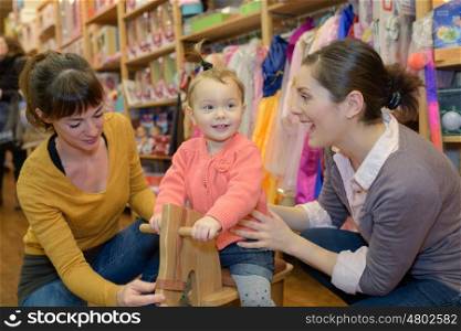 mother buy toy for her child