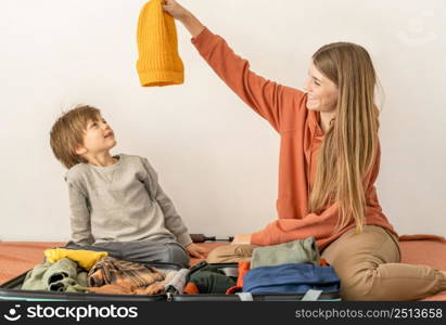 mother child preparing luggage trip