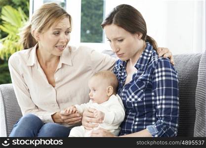 Mother Comforting Adult Daughter Suffering With Post Natal Depression