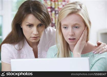 Mother Comforting Daughter Victimized By Online Bullying