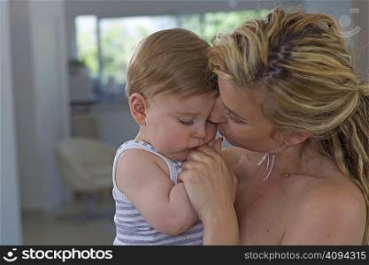 Mother consoles baby