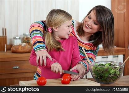 Mother cooking with daughter