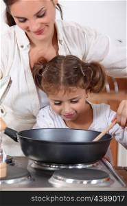 Mother cooking with daughter