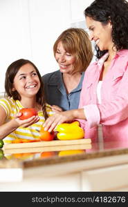 Mother,daughter and grandmother cooking