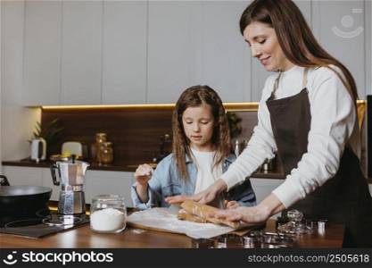 mother daughter cooking kitchen home