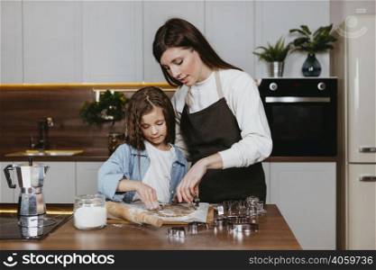 mother daughter cooking together kitchen