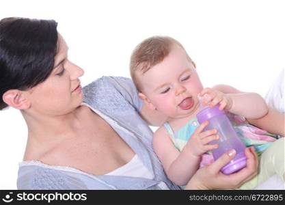 Mother feeding bottle to baby