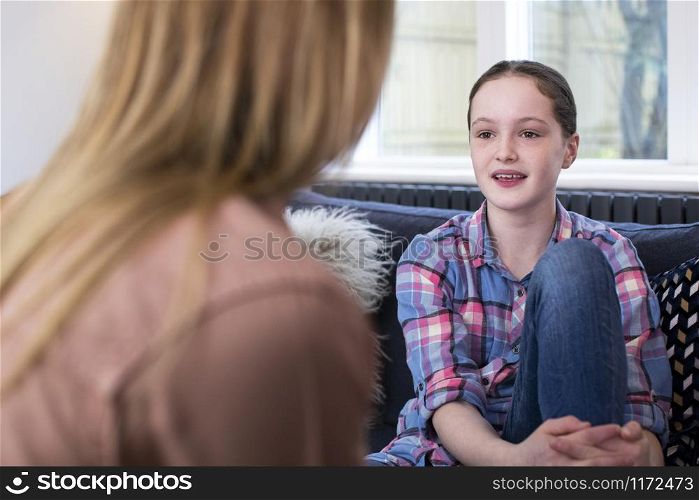 Mother Having Serious Conversation With Young Daughter At Home