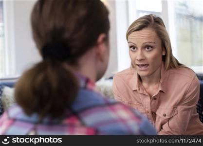 Mother Having Serious Conversation With Young Daughter At Home